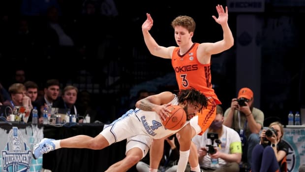 Mar 11, 2022; Brooklyn, NY, USA; North Carolina Tar Heels guard R.J. Davis (4) drives around Virginia Tech Hokies guard Sean Pedulla (3) during the second half of an ACC Tournament semifinal game at Barclays Center. Mandatory Credit: Brad Penner-USA TODAY Sports